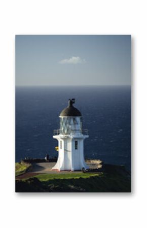 Lighthouse at Cape Reinga, the most northern point of New Zealand accessible by street. A single cloud just above the lighthouse.