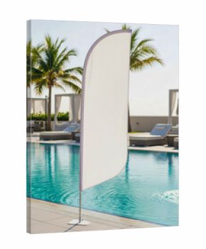 Feather flag mockup blank white banner by the swimming pool of a luxury hotel or resort