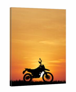 Motorcycle Silhouette at Sunset: A solitary motorcycle stands silhouetted against the vivid hues of a setting sun, painting a picture of adventure and freedom.