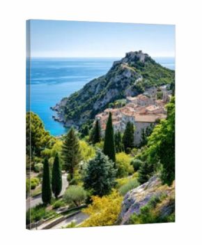 Scenic coastal village with historic castle and lush greenery under blue skies