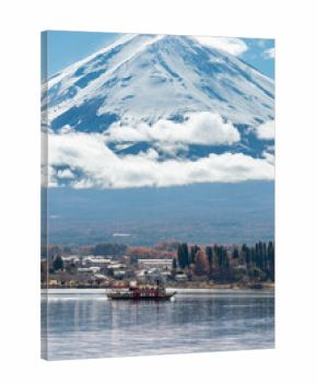 Landscape beautiful nature of lake Kawaguchiko with Mt Fuji covered in snow and red maple tree leaves in winter autumn season. Travel Japan scenery landmark famous place and season change concept.