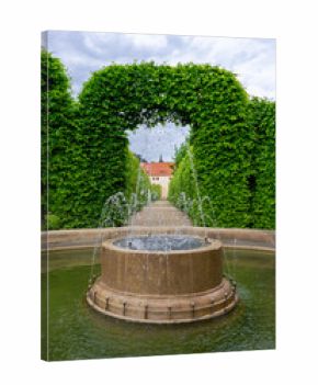 Fountain in Prague's Wallenstein Garden with Green Arch.