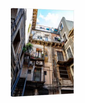 Realistic view of historical streets of Catania, Sicily, facade of old buildings. Winer time