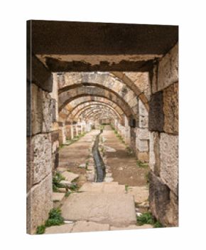Ancient stone arches and drainage channel in Roman-era ruins of Agora of Smyrna Izmir Turkey