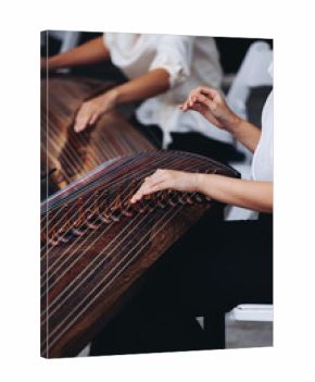 Traditional Korean folk musical instrument Gayageum, female orchestra band performing concert on Kayagum in of Seoul, South Korea, wooden zither with 12 strings, Koto or Guzheng live music performance