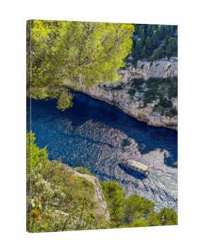 Calanque d'en vau boat navigating mediterranean sea canyon