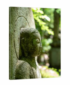 Monk statue in serene Mitaki-Dera temple garden in Hiroshima