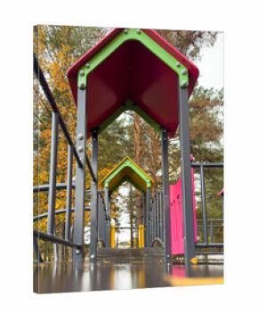 A playground with a red and green roof