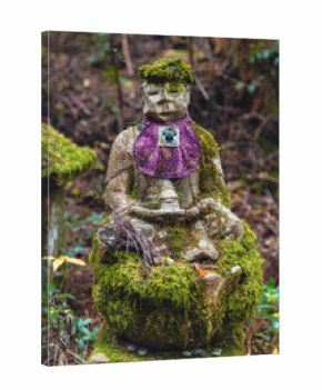 Jizo statue in mossy forest at koyasan okunoin