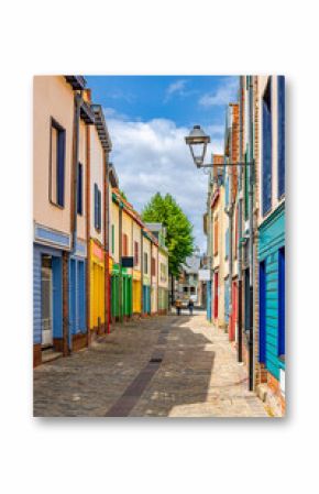 Colorful houses of Amiens historical city centre Saint-Leu quarter with colorful houses. Multicolored buildings on narrow street of old French town, vertical view, Hauts-de-France Region, France