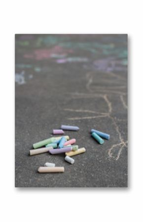 Asphalt surface covering with sidewalk chalking drawings