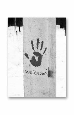A palm print on concrete, a symbol or a sign