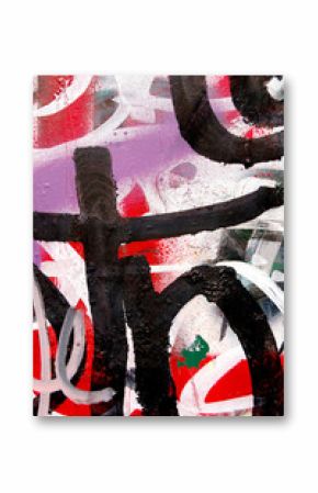 A surface covered with layers of graffiti and tags.