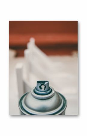 Can of aerosol paints white color after painting