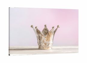 Royal crown on pink background