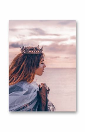 fashion model portrait. young pretty woman with crown outdoors at sunset