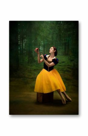 Young ballet dancer as a Snow White with poisoned apple in forest. Flexible caucasian ballerina dances like character of fairytail in bright clothes. Adorable and elegance story in motion and dancing.