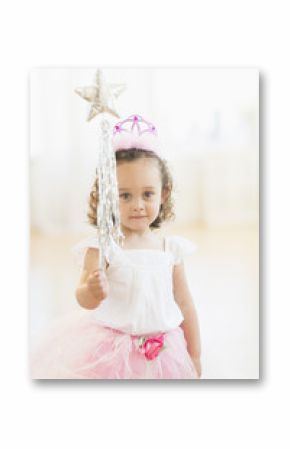Mixed race girl playing dress up