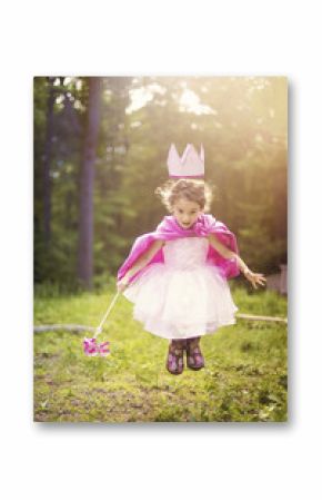 Girl playing princess in backyard