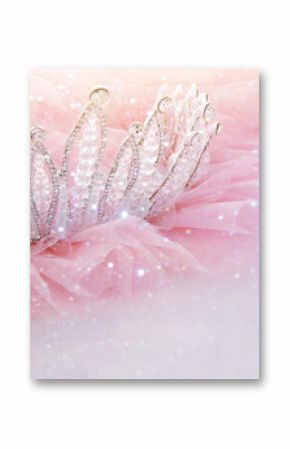 Vintage tulle pink chiffon dress and diamond tiara on wooden white table. Wedding and girl's party concept