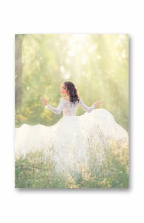 elegant and tender girl with black hair in white elegant light dress, lady runs in forest, turning pretty face on camera, her long train flying and fluttering in wind in bright rays of sunlight