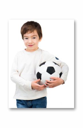 Little boy playing soccer ball