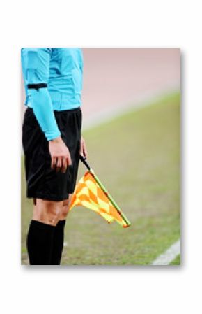 Assistant referee signaling with the flag