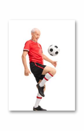 Joyful senior juggling a football and smiling