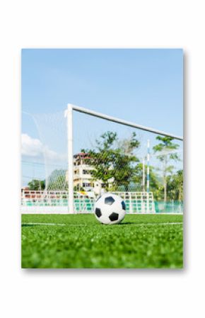Soccer Football on the green grass of Soccer field.