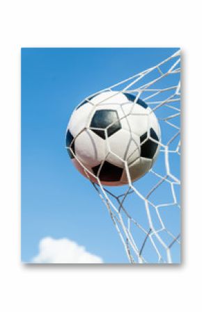 Soccer football in Goal net with the sky field.