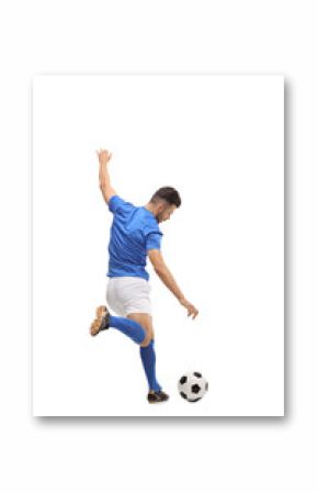 Soccer player kicking a football