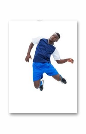 Football player in blue heading ball