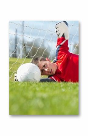 Goalkeeper in red making a save