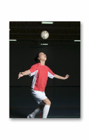 A female soccer player in a stadium