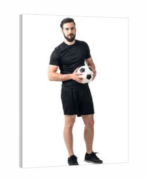 Confident soccer of futsal player holding ball with daring look at the camera. Full body length portrait isolated over white background.