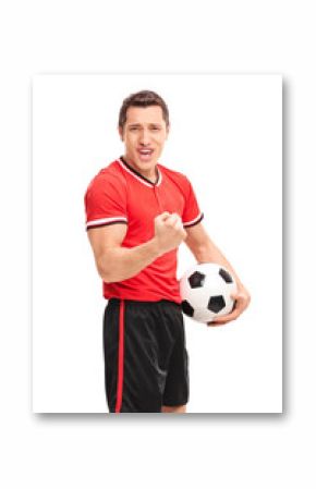 Happy football player holding a ball