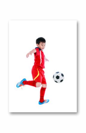 Young asian soccer player with soccer ball. Studio shot.