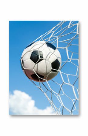 Soccer football in Goal net with the sky field.