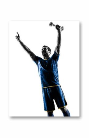 one caucasian soccer player man happy celebration trophy cup   in silhouette isolated on white background