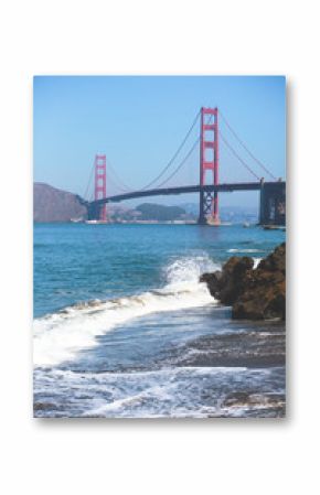 Classic panoramic view of famous Golden Gate Bridge seen from Baker Beach in beautiful summer sunny day with blue sky, San Francisco, California, USA