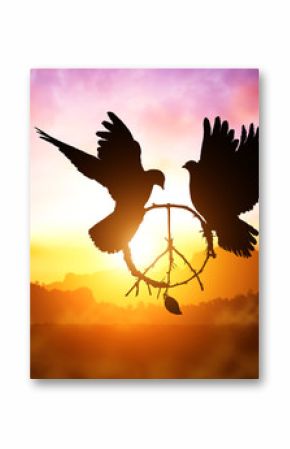 silhouette of pigeon dove holding branch in peace sign shape