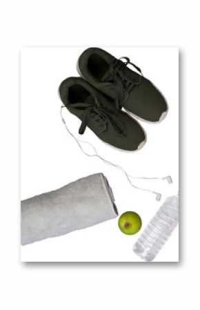 Sport shoes with towel, apple, and water bottle