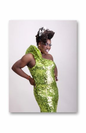 Drag queen wearing a green gown with sequins.