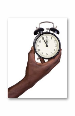 Man holding alarm clock isolated on white