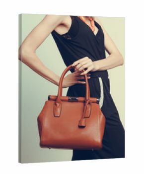 Elegant fashion woman with leather handbag