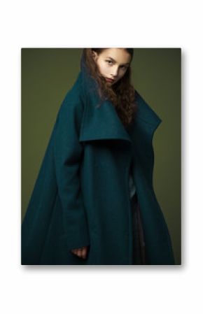 fashion model woman coat and hat urban style pose on color