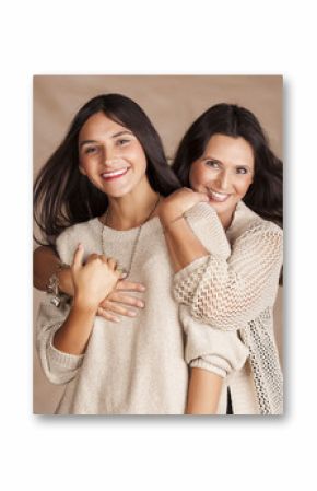 cute pretty teen daughter with mature mothr hugging, fashion