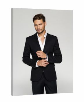 Portrait of handsome man in black suit