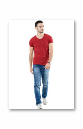 Young handsome casual man walk towards camera looking away. Full body length portrait isolated over white studio background.
