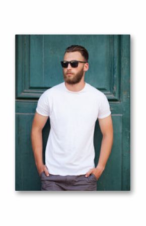 Hipster handsome male model with beard  wearing white blank  t-shirt with space for your logo or design in casual urban style